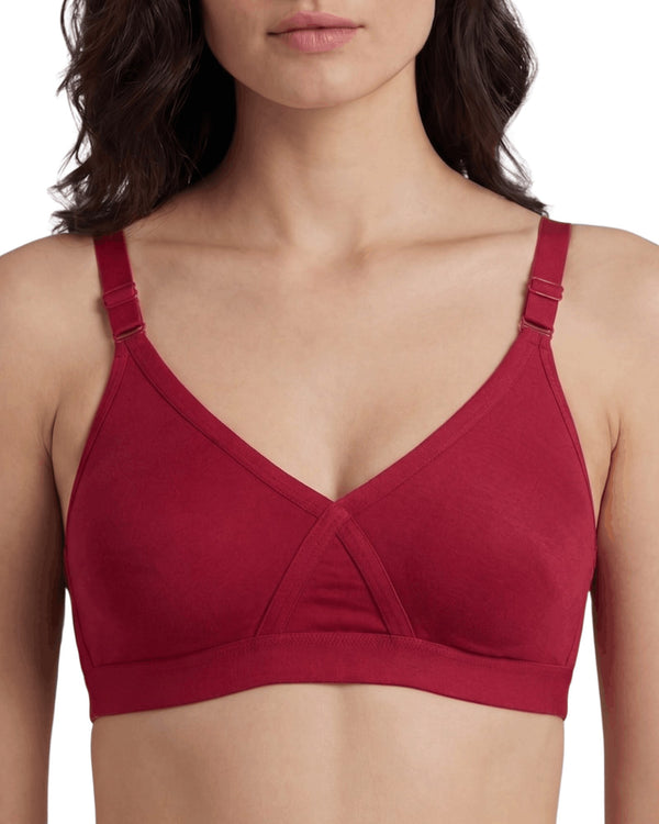Red AlplSenorita full coverage non-padded bra in soft interlock fabric, close-up on a model